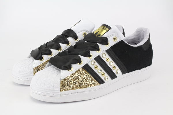 Adidas black store with gold sparkles